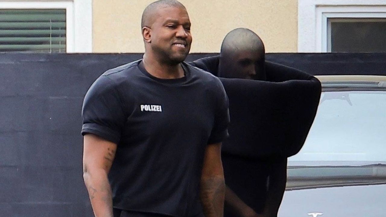Kanye West Wore His Black Signature Vetements ‘Polizei’ Shirt and Leggings with spouse Bianca Censori Who Channeled Maison Margiela