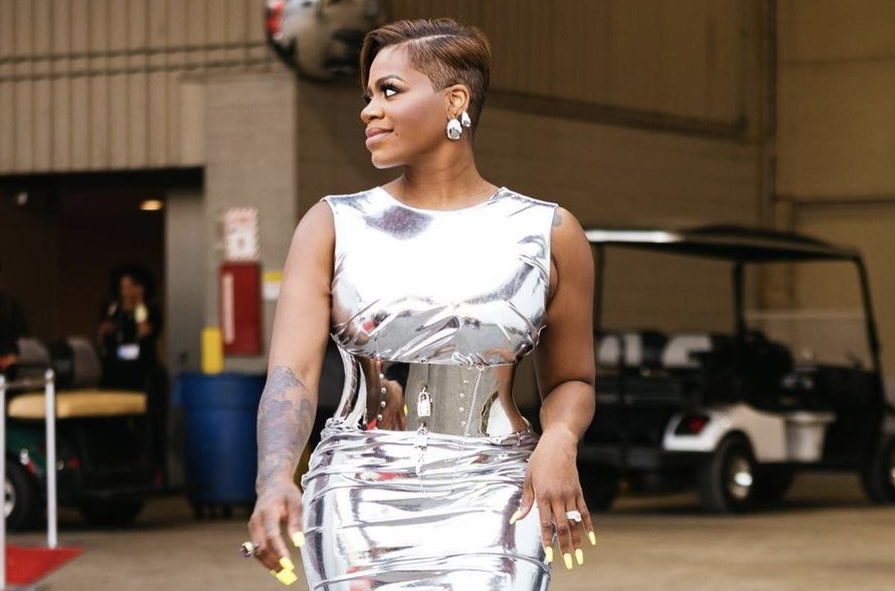 Hot Or Hmm?: Fantasia Wore a Corseted Dolce and Gabbana Chrome Midi Dress to ESSENCE Fest