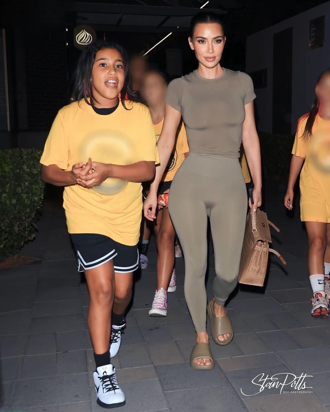Kim Kardashian Sported an Army Green Skims Look with Yeezy Slides and a 24K Hermes Crocodile Kelly handbag at Norths Basketball Game Shop the look 3