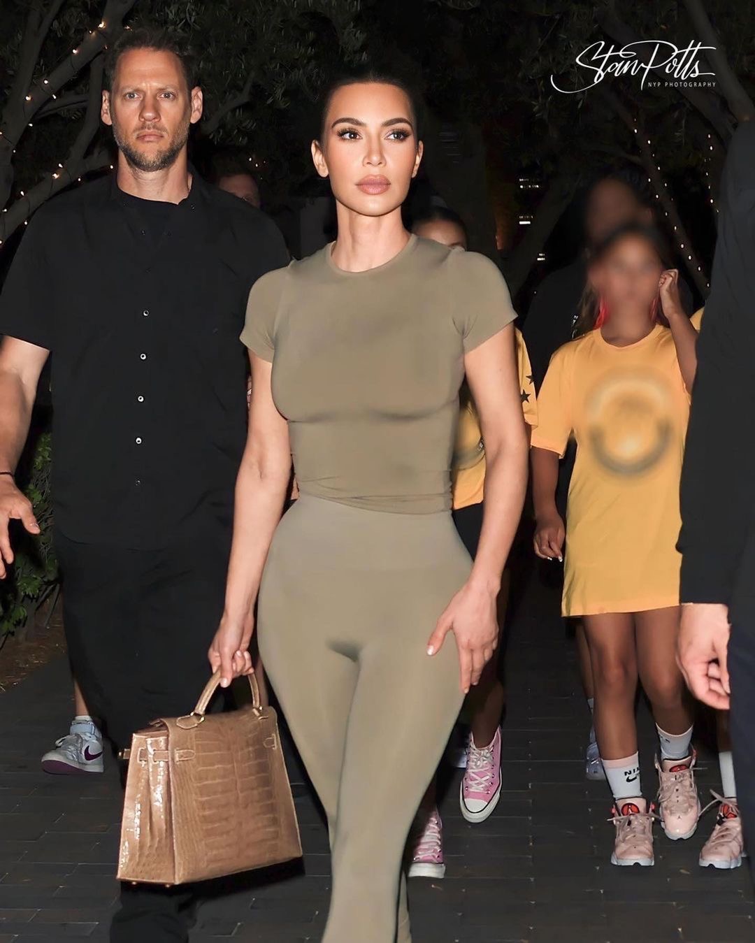 Kim Kardashian Sported an Army Green Skims Look with Yeezy Slides and a 24K Hermes Crocodile Kelly handbag at Norths Basketball Game Shop the look 5
