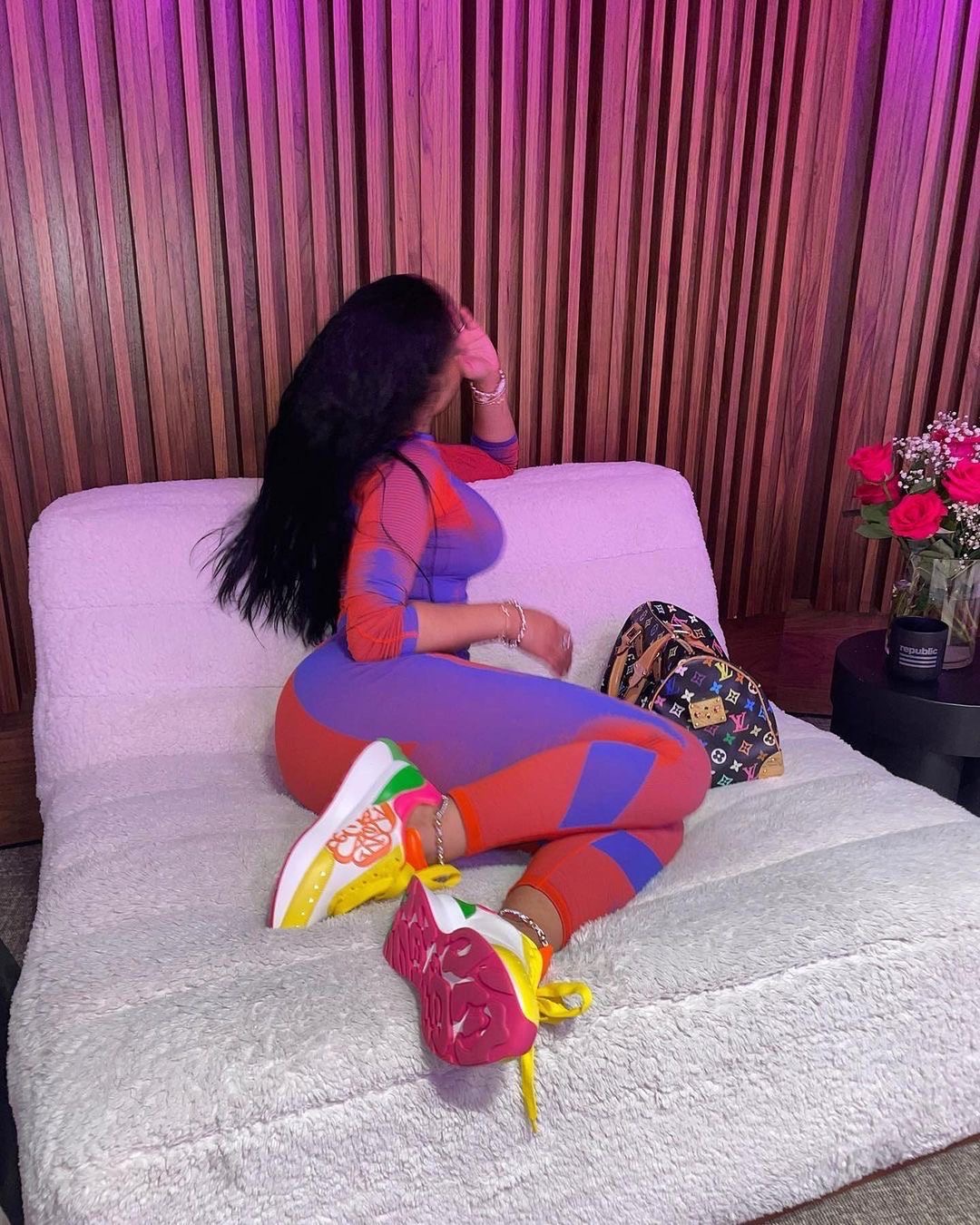 Nicki Minaj Wore a Red and Purple Y 3 Knit Set with 790 Alexander McQueen Color block Sneakers and a Louis Vuitton Murakami Handbag 7