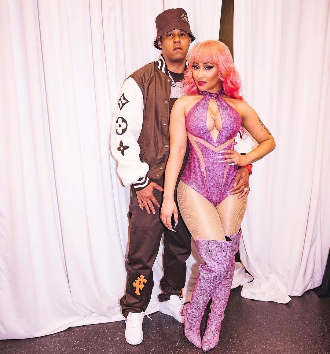 Fashion Bomb Couple Nicki Minaj Wore a Custom Versace Look with Hubby Kenneth Petty in a 6250 Louis Vuitton Jacket and 810 Hat Backstage at her Gag City Tour 3