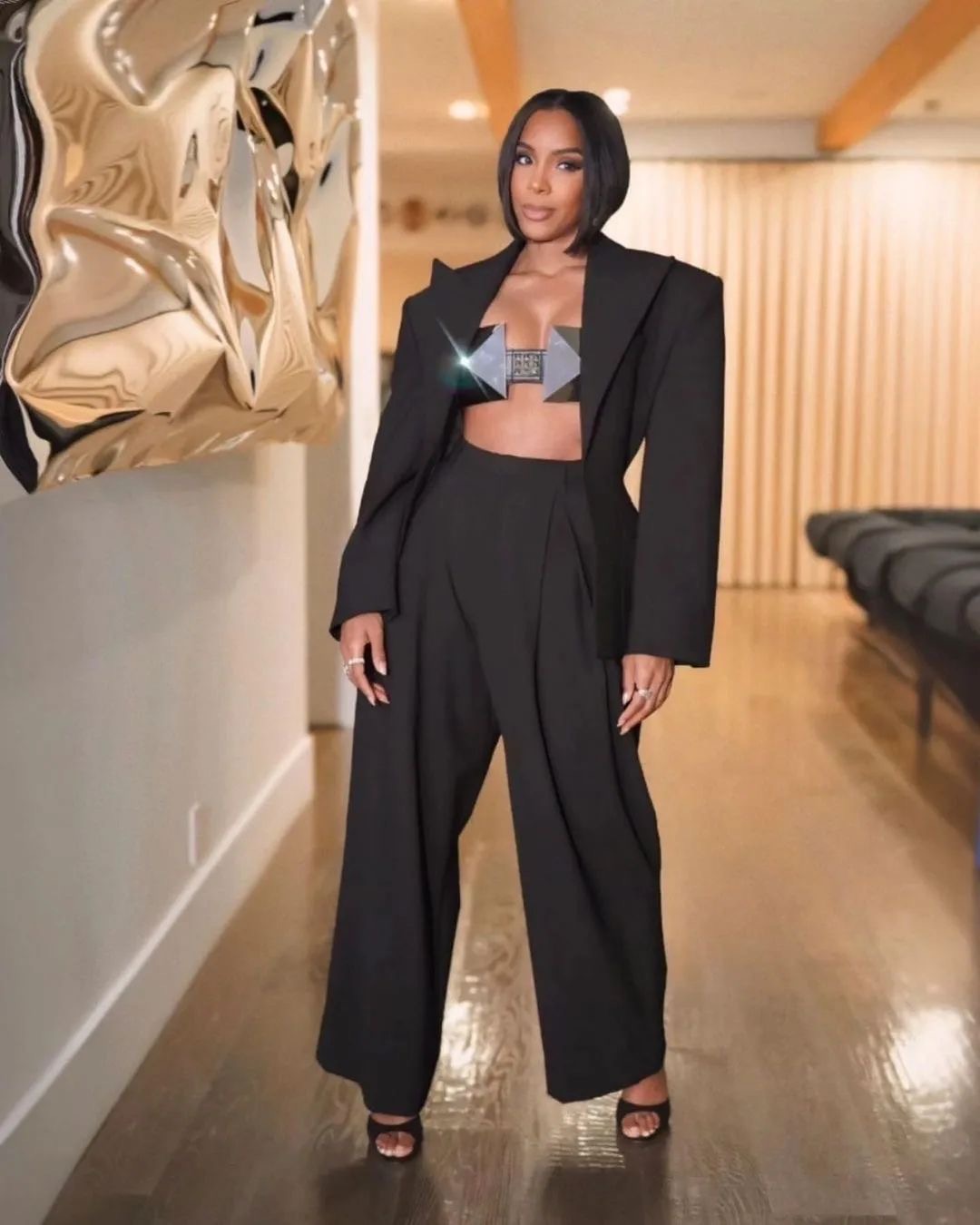 Kelly Rowland Wore a Black Giuseppe Di Morabito Look with a Metal Ashton Michael Bra and Black Ricagno Heels 3