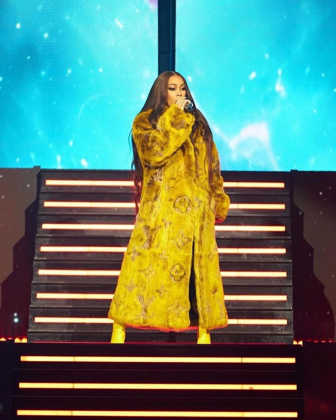 Monica Performed at Nicki Minajs Pink Friday 2 World Tour in a Yellow Louis Vuitton SS24 Fur Coat 2