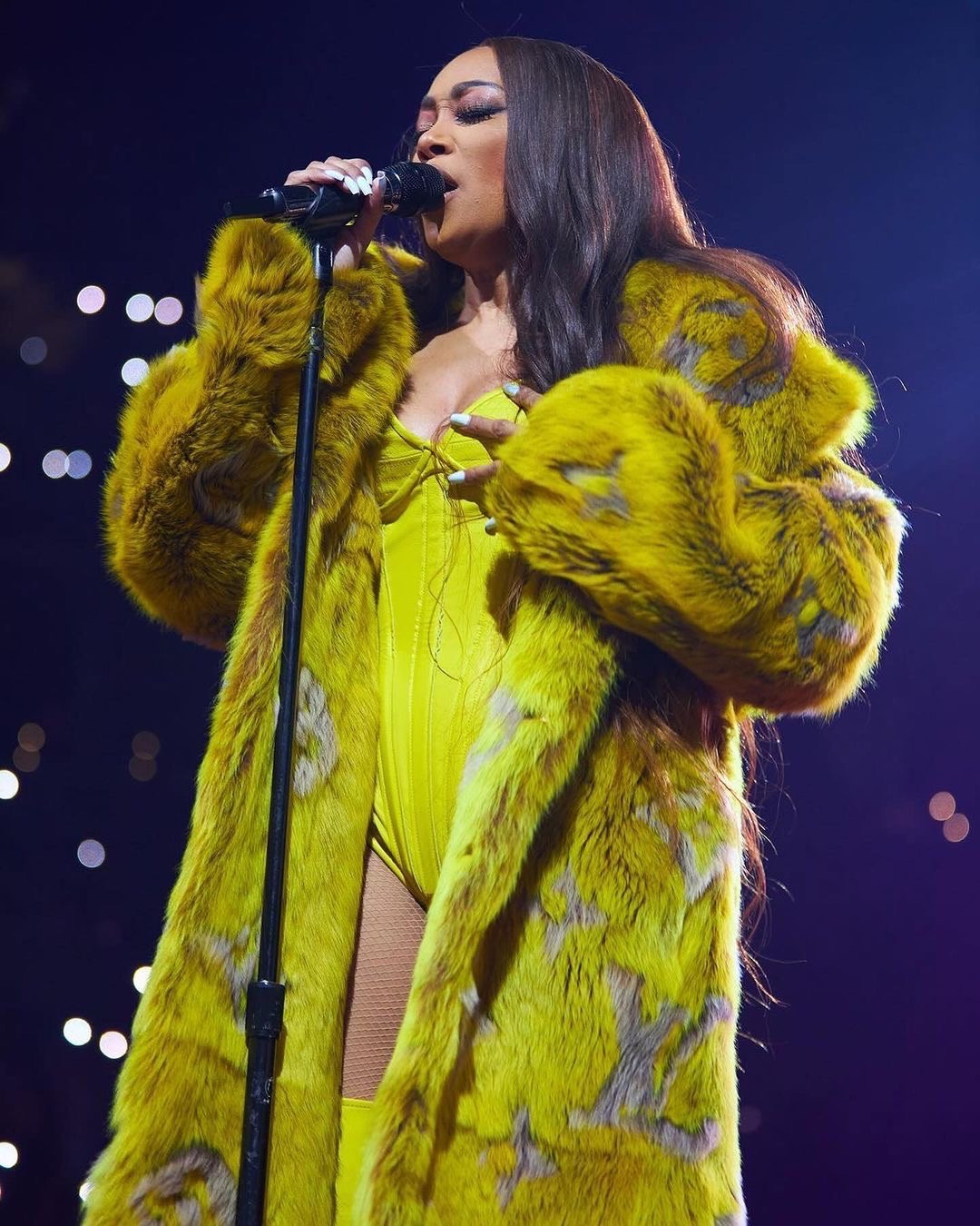 Monica Performed at Nicki Minajs Pink Friday 2 World Tour in a Yellow Louis Vuitton SS24 Fur Coat
