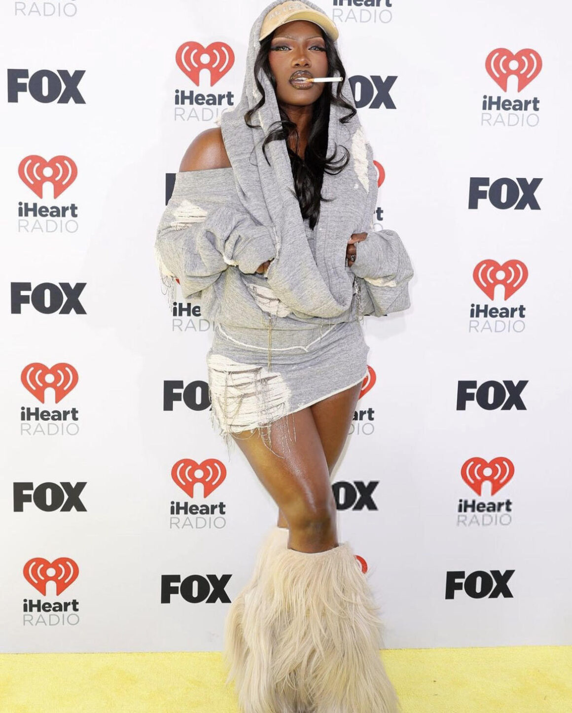 On the Scene at the iHeart Music Awards Beyonce Wins Big in a Black Vintage Versace Look Jennifer Hudson in Taller Marmo Latto in Fanci Club More 8