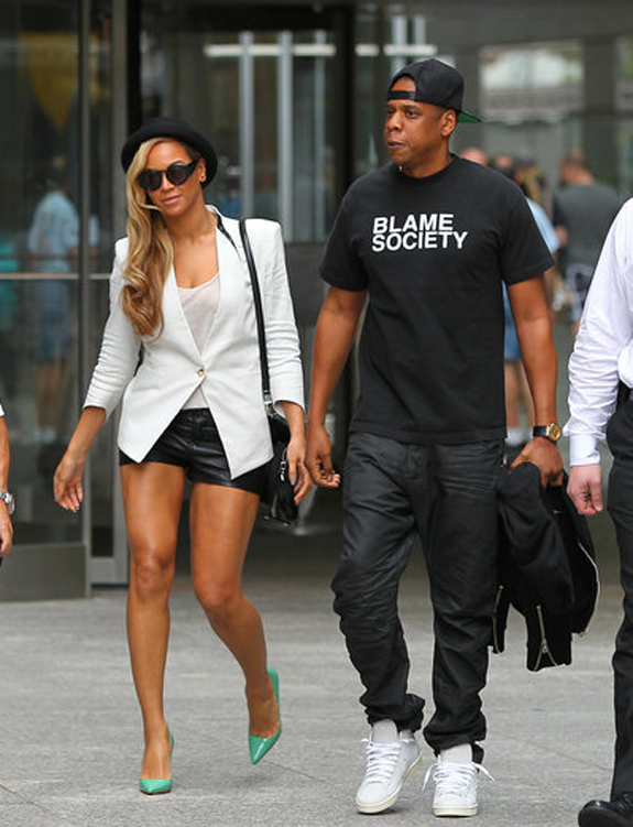 Get the Look: Jay-Z’s New York City Frank & Jan Black Blame Society T-Shirt and Beyoncé’s Helmut Lang White Era Blazer, Leather Shorts, and Green Pumps