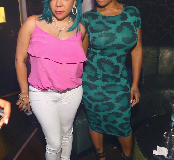 Hot! or Hmm…: Tiny’s XS Lounge Valentino Multicolor Glitter Rockstud Pumps + Toya Wright’s Topshop Green Leopard Dress and Giuseppe Zanotti Sandals