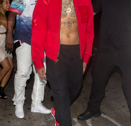 Men’s Fashion Flash: Chris Brown’s RNWND LA Red ‘B’ Varsity Jacket and Adidas Tubular Sneakers