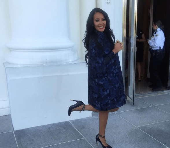Splurge: Angela Simmons’s White House Better Make Room Announcement Valentino Navy Blue Butterfly Print Cape, Print Goergette Dress, and Tom Ford Black Padlock Pumps