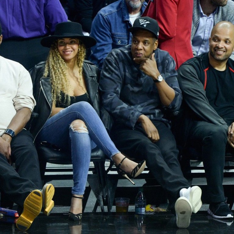 Splurge: Beyonce’s Clippers vs. Thunder Game Saint Laurent Classic Leather Jacket, Genetic Denim Shya Cigarette Distressed Jeans, and Gianvito Rossi Suede & Mesh Ankle Strap Pumps + Jay Z’s Valentino Camouflage Print Sweatshirt