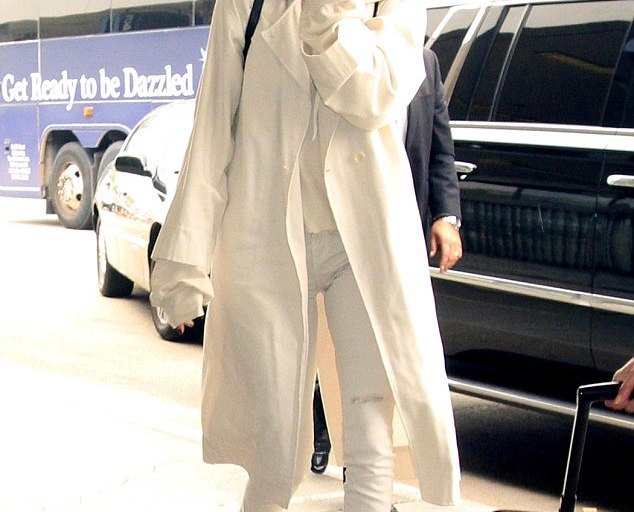 Splurge: Kendall Jenner’s LAX Airport Unravel Oversized Cashmere Hoodie, Raquel Allegra Military Trench Coat, and Balenciaga Studded Side-zip Ankle Booties