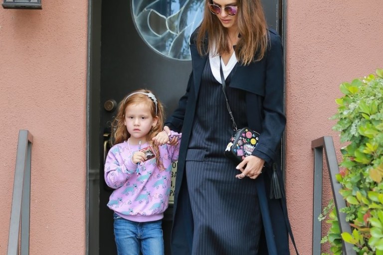 Splurge: Jessica Alba’s Los Angeles DKNY V-Neck Pocket Dress, Anya Hindmarch All Over Wink Crossbody, and Sandro Anita Velcro Sneakers