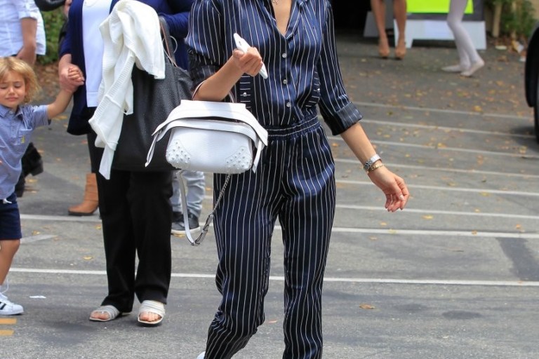 Splurge: Alessandra Ambrosio’s Los Angeles Shopping Linda Farrow 421 Sunglasses, Anthony Vaccarello Pinstripe Jumpsuit, and Tod’s Mini Wave Bag