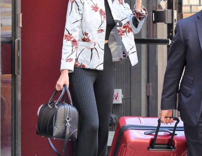 Splurge: Kendall Jenner’s Ganni Sanders Quilted Floral Printed Satin Jacket and Balmain Black Ribbed Flare Pants