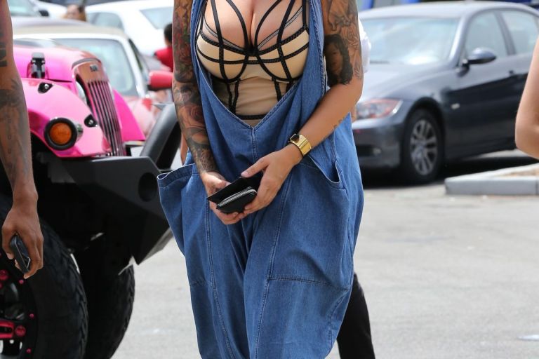 Hot or Hmm…: Amber Rose’s Cheesecake Factory 69 Crossover Oversized Linen Overalls and Balmain Eagle Ranger Embroidered Suede Boots