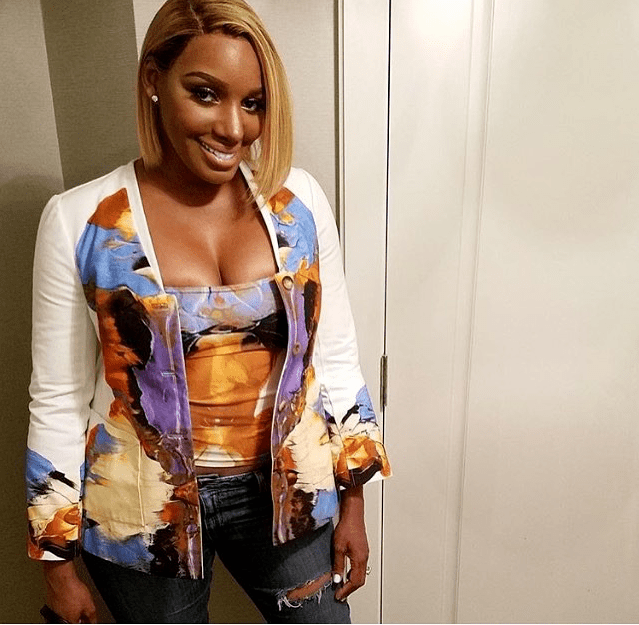 Wardrobe Query: Nene Leakes’s Instagram Ralph Rucci Resort 2014 Rorschach Printed Purple and Yellow Top and Cardigan