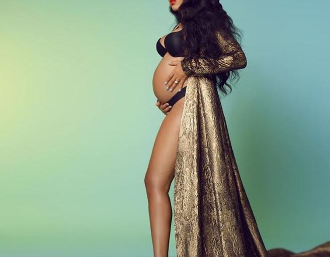 Hot or Hmm…: Angela Simmons’s Maternity Shoot Stello Naomi Gold Dress and Vauje Royal Crown
