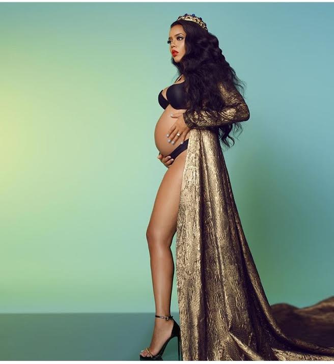 Hot or Hmm…: Angela Simmons’s Maternity Shoot Stello Naomi Gold Dress and Vauje Royal Crown