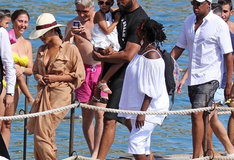Splurge: Beyoncé’s Capri Alberta Ferretti Beige Silk Shirt Dress and Zimmermann Ticking Wrap Cutout Striped Swimsuit