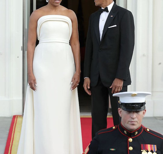First Lady Michelle Obama wears a Custom Brandon Maxwell Strapless Ivory Sponge Crepe Gown to the White House State Dinner