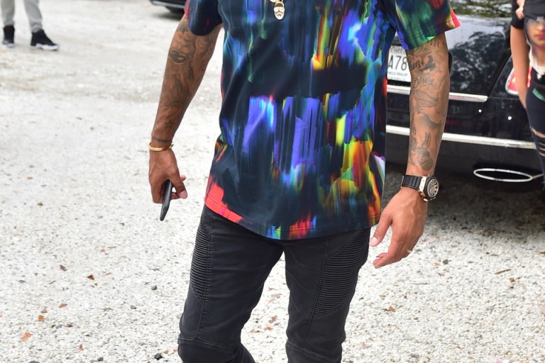 Men’s Fashion Flash: Kenny Burns’s Atlanta Y-3 Hand Painted Effect Multicolor T-Shirt, Black Balmain Jeans, and Maison Martin Margiela Gold Shoes