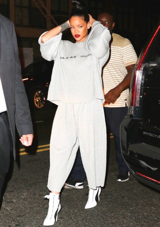 Rihanna Hits New York City in a Dries Van Noten Sleeveless Sweater and Striped Wide Leg Pants, a Gray Faustine Steinmetz Pleated Sweatshirt and Trackpants, and More!