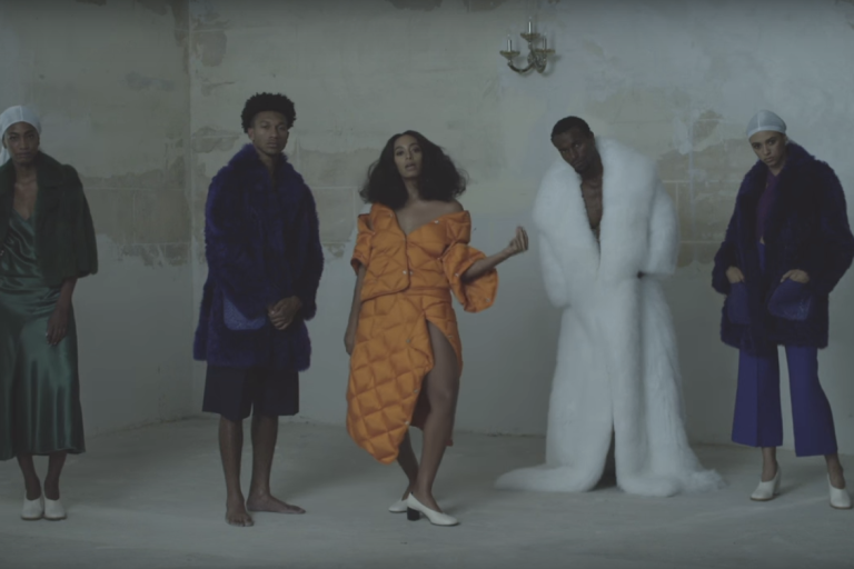 Splurge: Solange Knowles’s “Cranes In The Sky” Music Video $1,150 Acne Studios Baltimore Down Orange Coat