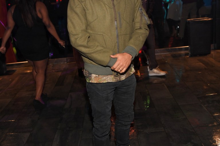Men’s Fashion Flash: Kenny Burns’s Nelly Compound Valentino Star Motif Olive Green Jacket, Saint Pablo Tour Camouflage Tee, Balmain Jeans. and Nike SF Utility Air Force 1’s