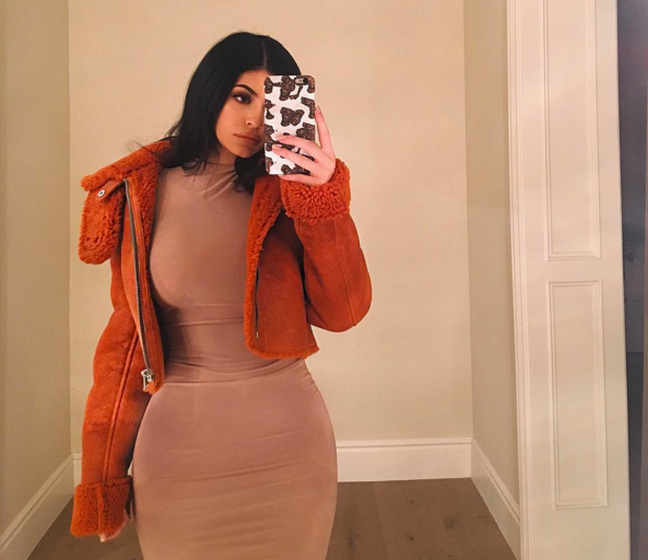 Splurge: Kylie Jenner’s Instagram $1,150 Yeezy Orange Shearling Cropped Flight Coat