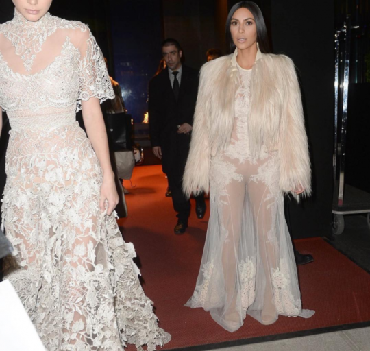 Kim Kardashian Wears Givenchy Fall 2010 Couture Sheer Gown and Fur Coat, Kendall Jenner Wears Elie Saab Spring 2016 Couture, and Kylie Jenner Wears Vetements Camo Coat for Shoot on Ocean’s Eight