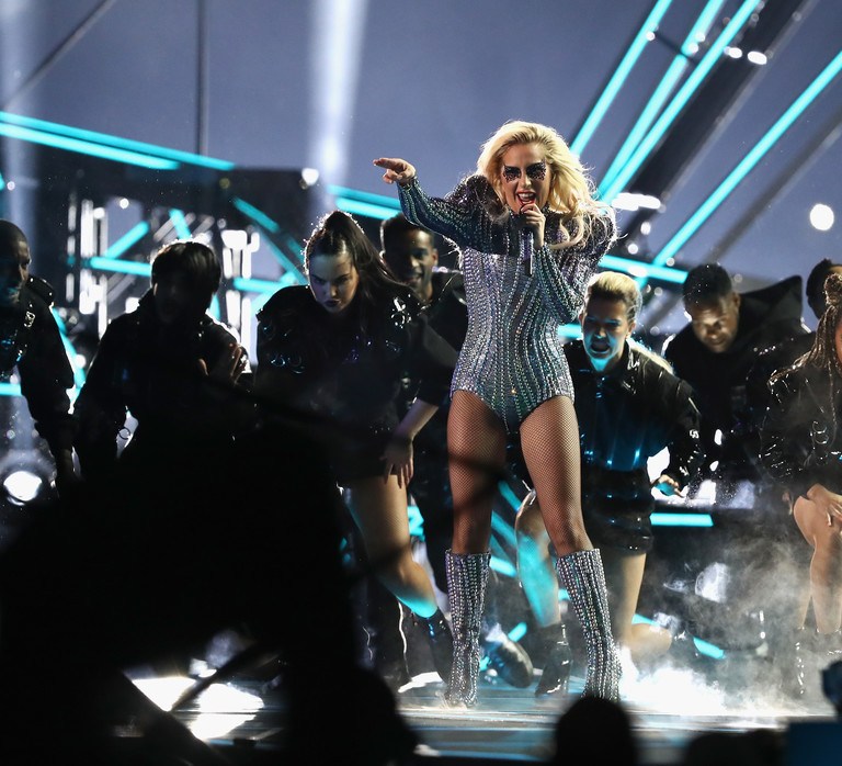 Superbowl 51 Style: Lady Gaga Wears Custom Atelier Versace Iridescent Jumpsuit, Embellished Gold Jacket, and Cropped Sculptural Jacket