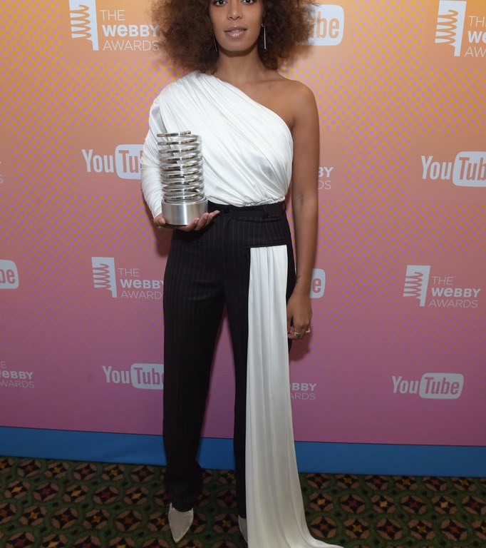 Hot! or Hmm…: Solange Knowles’s Webby Awards Seen Users White One Shoulder Top and Black Pants