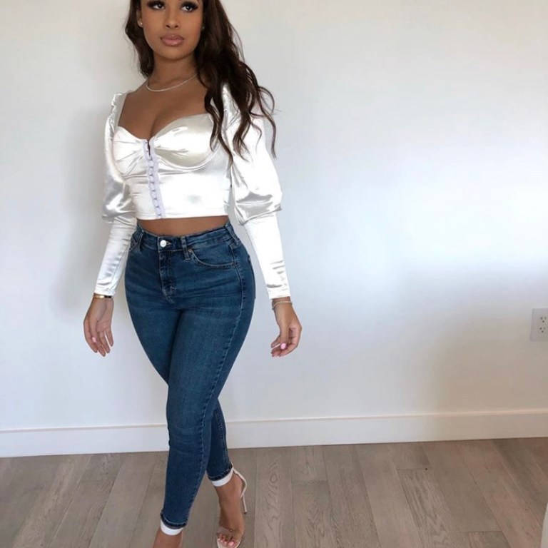Taina Williams Kept it Flirty in this White Fashion Nova Crop Top