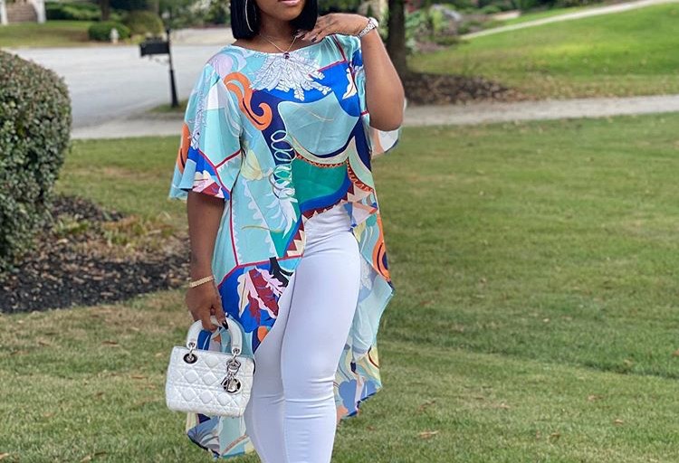 Toya Wright is a Tropical Treat in her Fashion Nova Multi-Colored Top, White Leggings and Clear Heels
