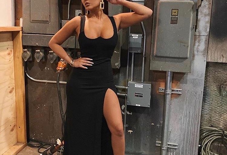 Adrienne Bailon is Beauty Defined in her Black Fitted Thigh High Cut Fashion Nova Sleeveless Dress