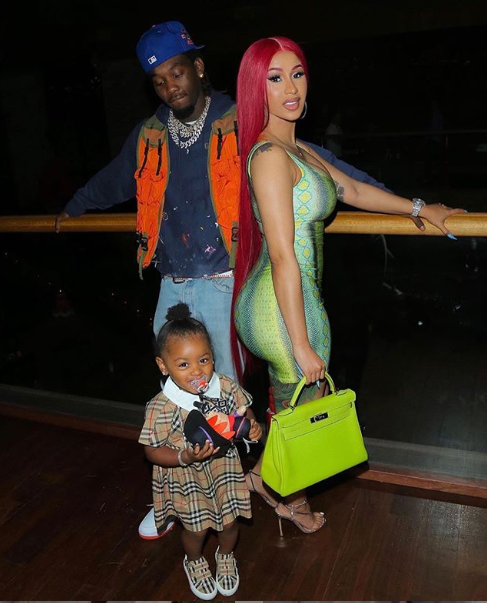 Cardi B Spends Fathers’s Day with Offset and Kulture in Adriana Sahar Neon Green and Blue Snake Print Dress