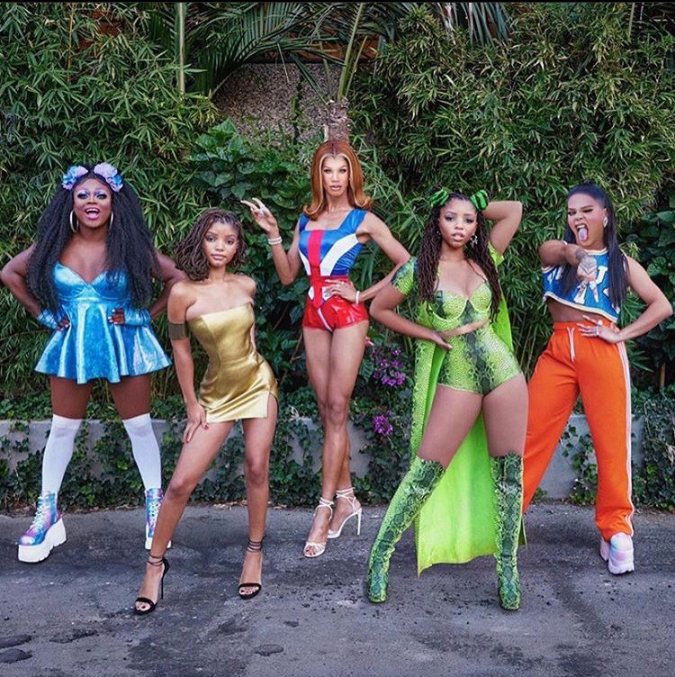 Chloe x Halle Perform at GLAAD Awards Wearing Custom Latex Designs by Venus Prototype Latex: Halle in Gold Mini Dress and Chloe in Green and Black Snake Print Two Piece Ensemble