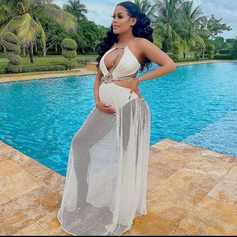 Keyshia Ka’oir Davis Showed Off her Baby Bump in a White PatBO Beaded Cutout Beach Dress