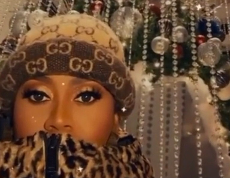 Missy Elliot Shows Off Her 18 Foot Caged Christmas Tree Wearing a Versace Leopard Print Puffer Jacket and Gucci Monogram Wool Hat