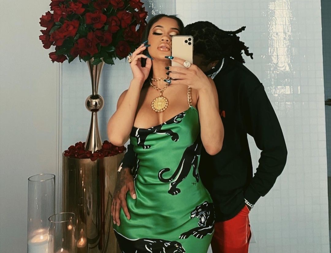 You Ask, We Answer! Saweetie's Valentine's Day Green Olivia von Halle Black Panther Print Chain Strap Dress