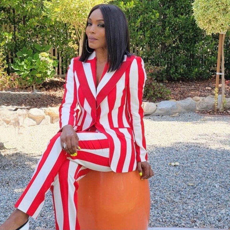 Angela Bassett Stuns in Summer-Ready Look Featuring Dolce and Gabbana Red and White Striped Pantsuit