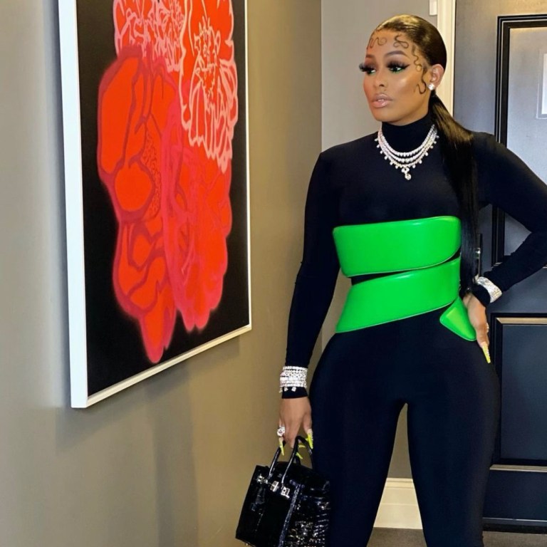 Keyshia Ka’oir Attends The NBA Finals Game Wearing Bottega Veneta Pieces Including the Green Wrapped Corset and Boots