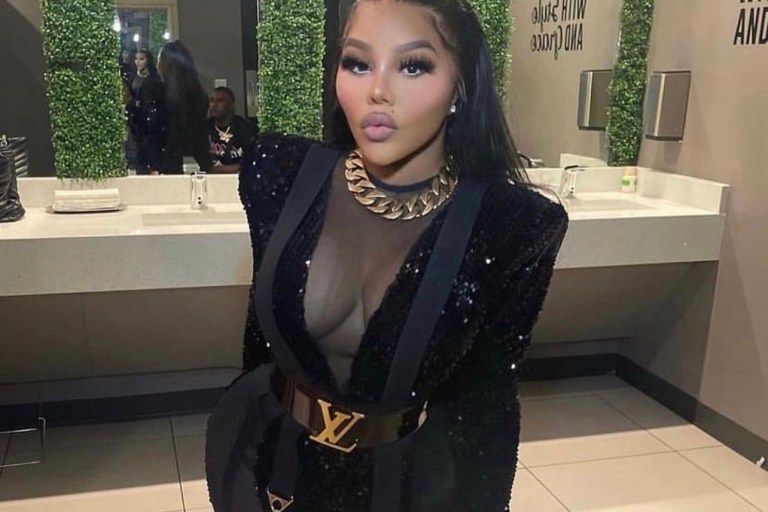 Lil Kim Performs at Mississippi’s Trapcella Wearing Custom Michael Costello Black Sequin and Mesh Jumpsuit, Louis Vuitton Logo Belt and Kandee Black Vinyl Boots