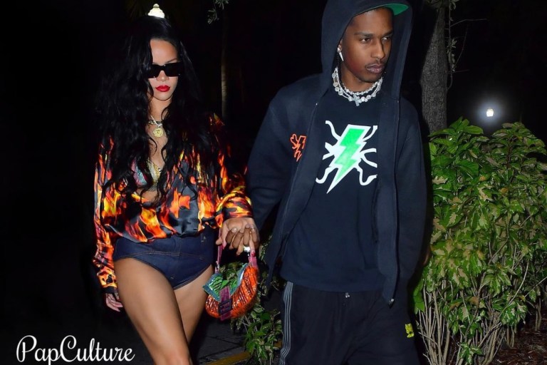 Rihanna Spotted in Miami Hand-in-Hand With A$AP Rocky Wearing Vetements Silk Flame Print Shirt and Fenty Denim Hot Pants