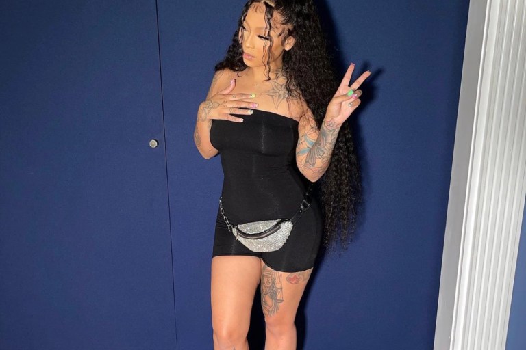 Cuban Doll Poses in Fashion Nova Black Tube Romper