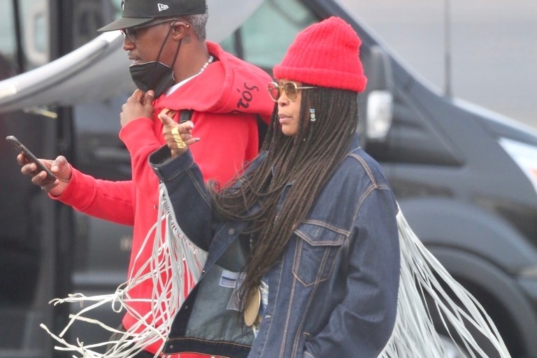Erykah Badu Deplanes for Barack Obama’s 60th Birthday in a Karl Welch x Levis Fringed Denim Jacket, Jahnkoy Printed Pants, and Nike x Off White Sneakers