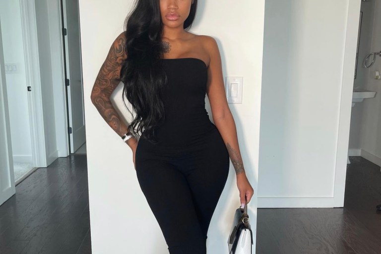 Jania Meshell Strikes a Pose in Fashion Nova Black Tube Lace-Up Jumpsuit