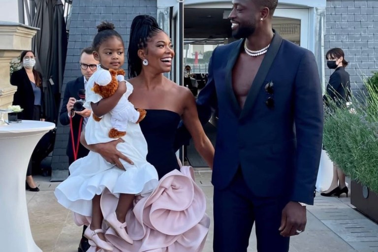 Kaavia James Shows Us She’s a Fashionista in the Making Wearing Lanvin White Ruffled Dress and Pink Ballet Flats at Parents Gabrielle Union and Dwyane Wade’s Anniversary Celebration in Paris