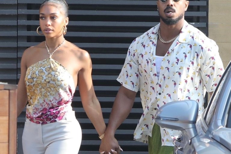 Lori Harvey and Michael B. Jordan Spotted Holding Hands After Lunch Date at Nobu: Michael B. Jordan Wears Saint Laurent Allover Print Shirt and Issey Miyake Green Plisse Shorts With Lori Harvey in Gem Print Halter Top, The Attico Split Hem Pants, and Bottega Veneta Crystal Leather and Mesh Sandals